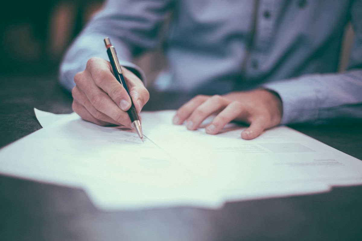 Signing documents at a table